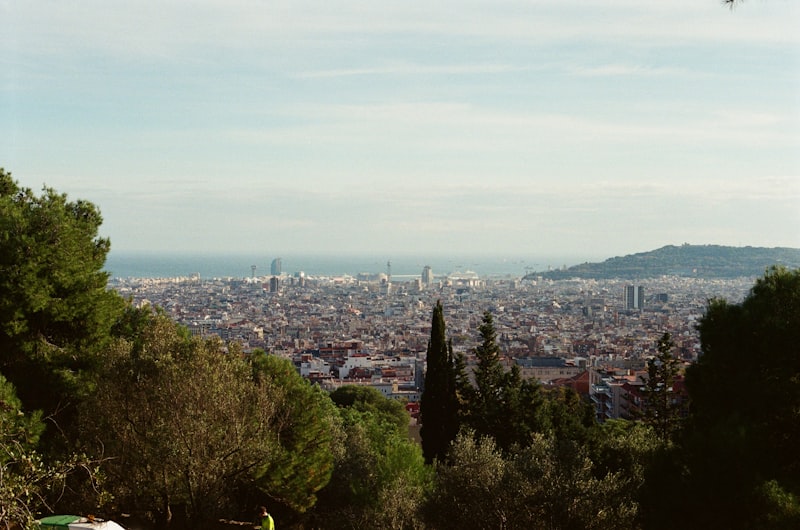 Park Güell mosaic terrace with Barcelona skyline in background