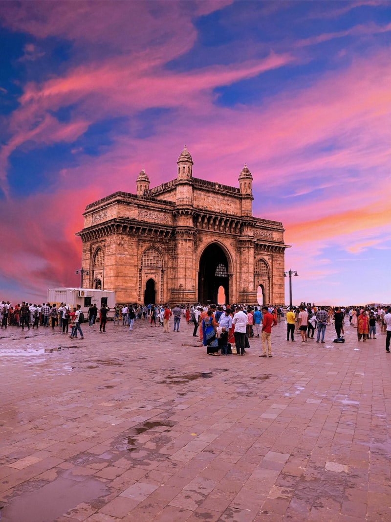 Marine Drive's Art Deco seafront promenade curving along Mumbai's coastline at sunset