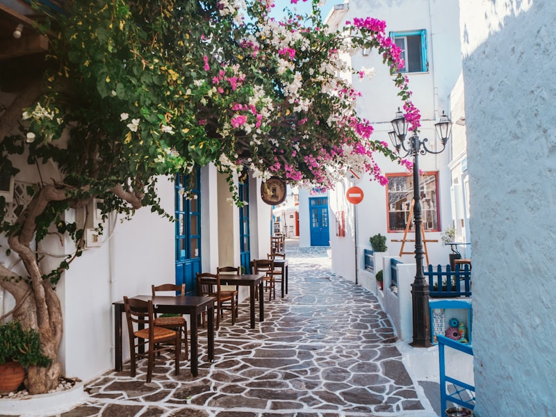 Iconic Mykonos windmills overlooking Little Venice at sunset