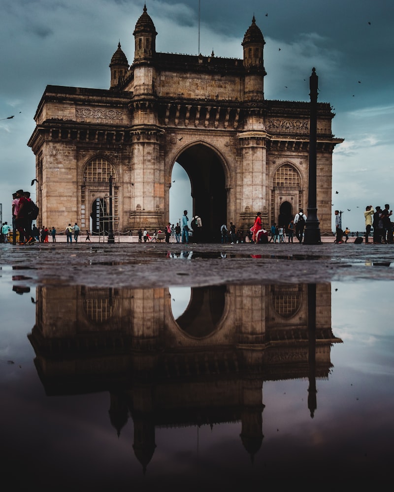 Gateway of India monument with Mumbai harbor behind it