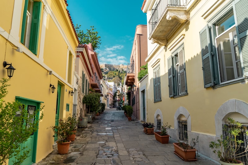 Colorful neoclassical houses lining a narrow Plaka alley in Athens