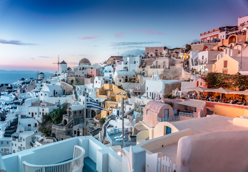 Oia village with white-washed buildings and blue domes in Santorini