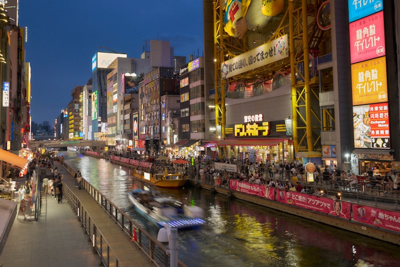 Dotonbori canal with neon signs at night in Osaka