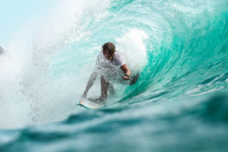 Surfer catching a wave at a Portuguese Atlantic beach