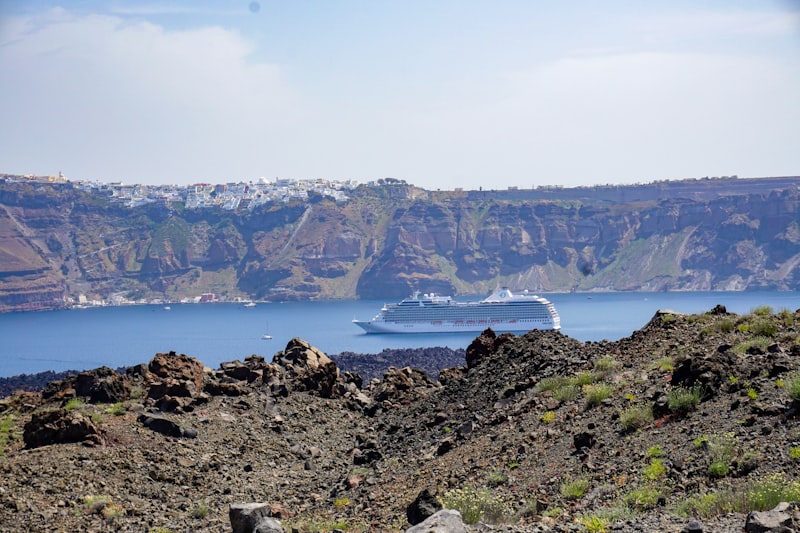 Hikers exploring the volcanic crater of Nea Kameni in Santorini's caldera