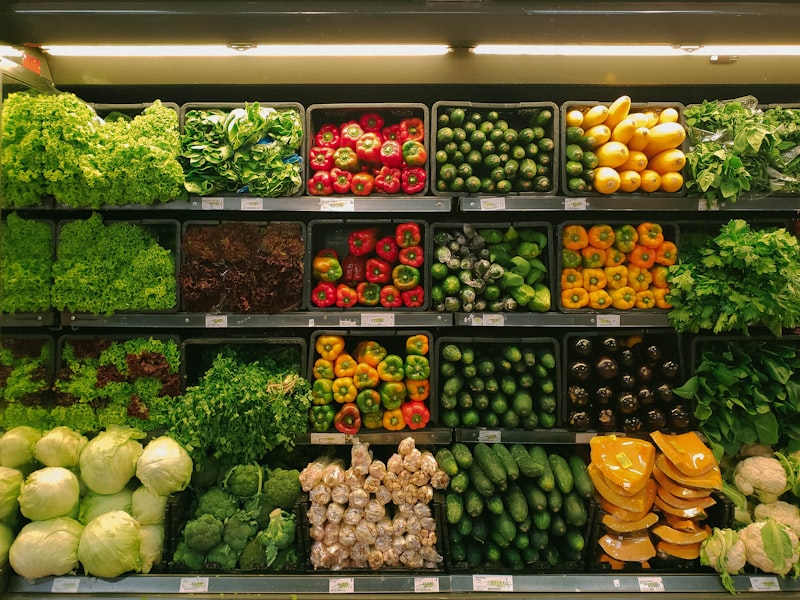 Fresh produce and vendors at an indoor public market